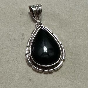Sterling silver tear drop pendant with onyx stone.